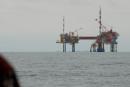 Sailing past oil platforms